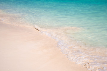 Fototapeta na wymiar Sand and caribbean sea background