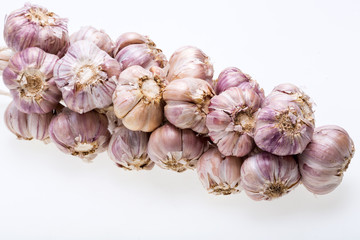 String of garlic isolated on white background