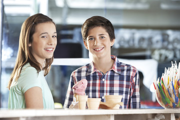 Smiling Brother And Sister With Strawberry Ice Cream