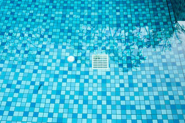 25 May 2016, Hotel swimming pool with sunny reflections, Swimming pool of luxury hotel, Swimming pool and wooden deck ideal for backgrounds