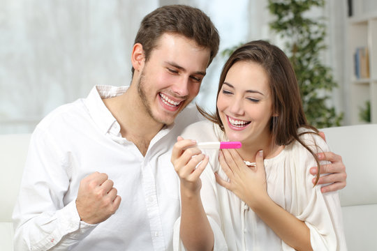 Happy Couple Making Positive Pregnancy Test