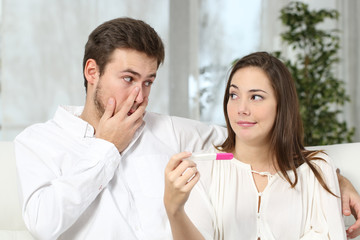 Worried couple making pregnancy test
