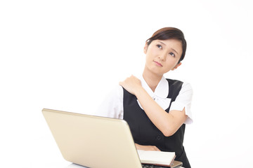肩こりを訴えるビジネスウーマン