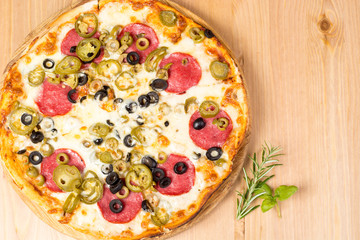 Pizza with ham and tomatoes