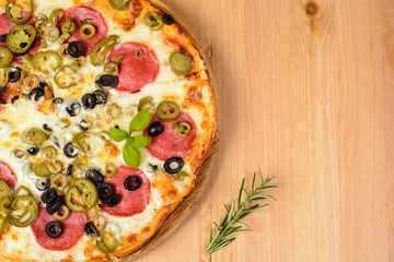 Pizza with ham and tomatoes
