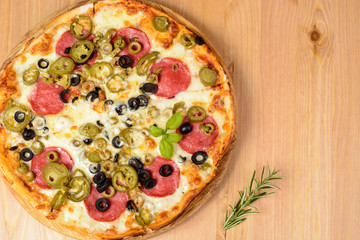 Pizza with ham and tomatoes