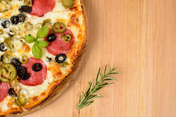 Pizza with ham and tomatoes