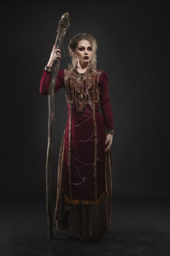 Woman witch with magic pikestaff