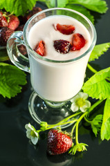 strawberry yogurt with strawberries on a dark background