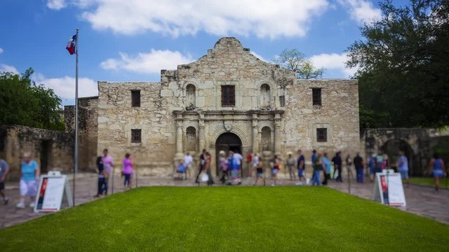 Exterior view of the historic Alamo in San Antonio, Texas with tourists, timelapse (People and signs blurred for commercial use)
