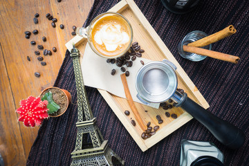 Top view coffee with cinnamon, anise and cane sugar and Paris mo