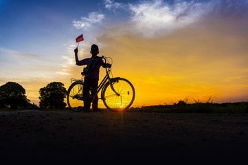 silhouette boy holding the malaysia flag