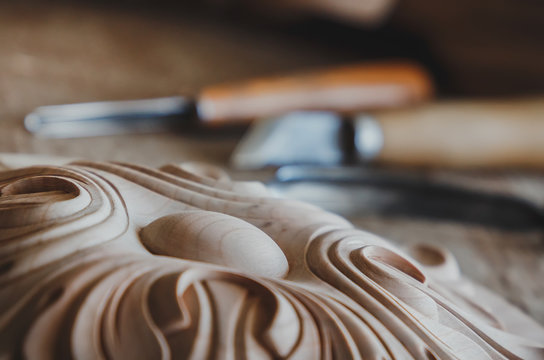 Timber, wood processing. Joinery work. wood carving with work tools close up. small depth of field. used as background