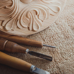Timber, wood processing. Joinery work. wood carving with work tools close up. small depth of field. used as background