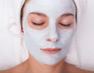 Young woman with facial mask