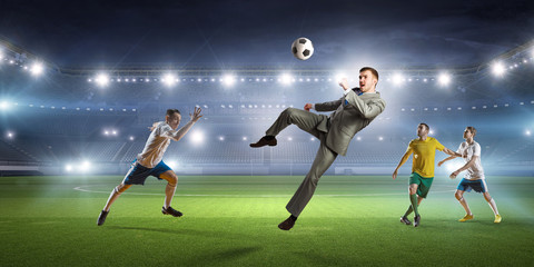 Businessman and players fighting for ball