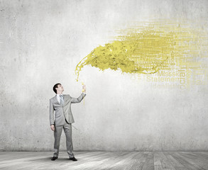 Obraz premium Businessman with yellow receiver