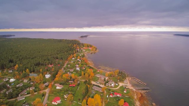 Aerial shot of the small town of Kasmu in Estonia where seen the town fronting the big sea on the side