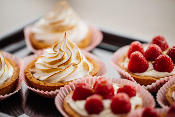 sweet basket with cream and raspberries
