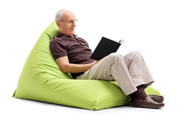 Senior gentleman reading a book