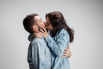 Portrait of happy couple on gray background