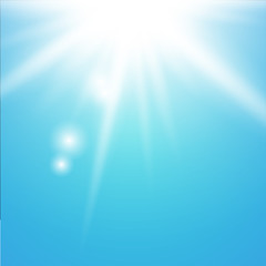 Sun with lens flare on blue background