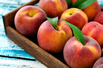 Fresh Peaches in a Wooden Basket 