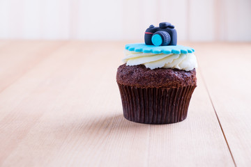 Delicious cupcake on table