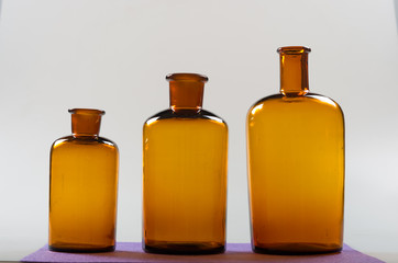 Different sizes of the bottles of an ancient drugstore.