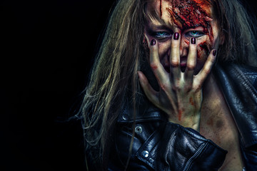 Close-up portrait of horrible zombie woman. Horror. Halloween