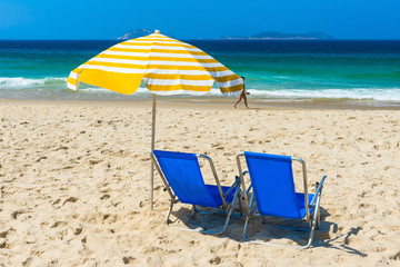 Beach chairs and umbrella on Ipanema beach in Rio de Janeiro, Brazil
