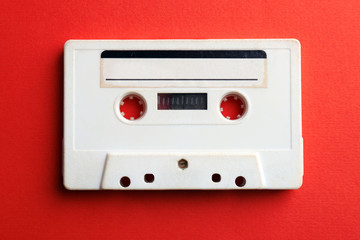 Obraz premium Old audio cassette on red background