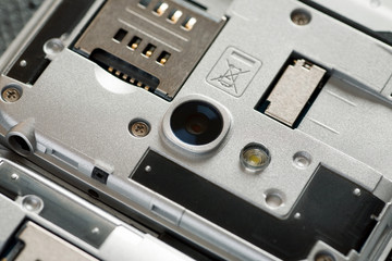 Disassembled cell phone with visible parts inside