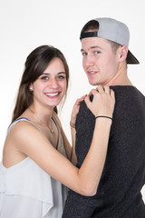 Cheerful young couple standing on white background, isolated
