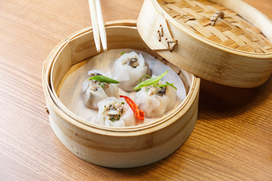 Dim sums with pork and mushrooms in asian restaurant