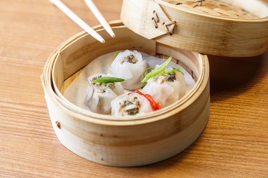Dim sums with pork and mushrooms in asian restaurant