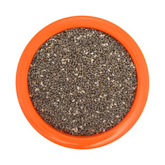 Chia seeds in an orange bowl on a white background