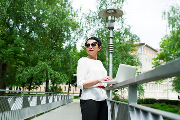 The business woman with the laptop.