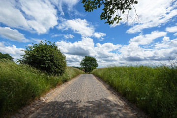 Cobbled road awesome sky