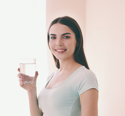 Beautiful girl drinking water