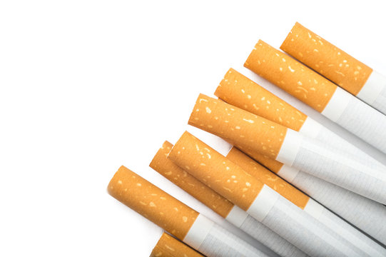 Many cigarettes over white background with copyspace