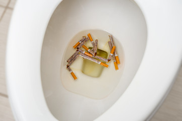 Quit Smoking : Cigarettes in the toilet