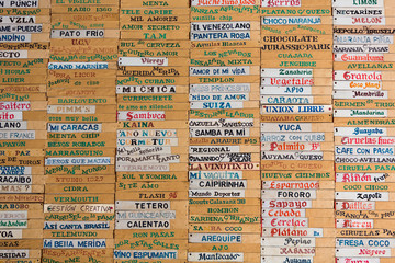 Old wooden board with all ice-cream names written in Spanish, Me