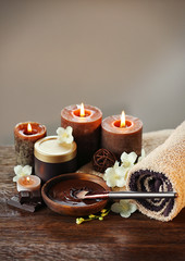 Spa chocolate set with candles on blurred background