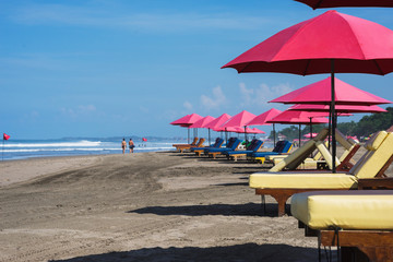 sunbeds and parasols on the beach.