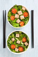 Vegan tofu salad with tomatoes and lamb's lettuce
