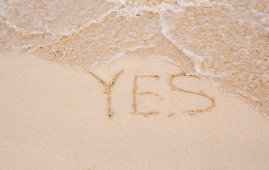 Yes - written in sand on beach texture