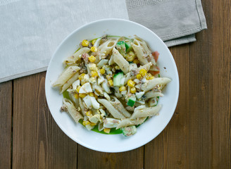 Salad with pasta, sardines .