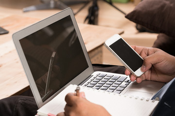 Fototapeta premium Hand to use a smartphone 