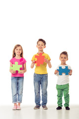 Cute children with puzzles